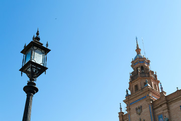 Fototapeta na wymiar Lampost and tower at Spain square