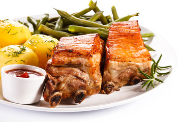 Grilled ribs, boiled potatoes and vegetables 
