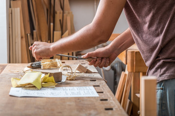 Obraz na płótnie Canvas Carpenter sanding wood