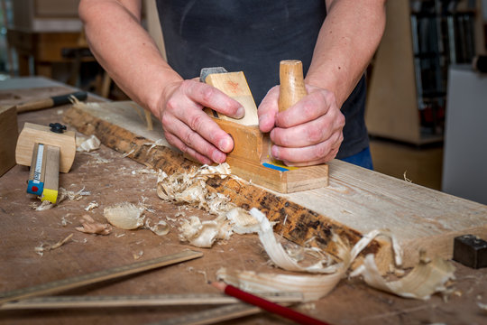 Carpenter carving wood