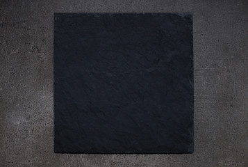 Black tray board on gray stone background