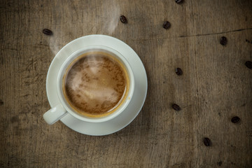 Cups of espresso on the wooden table in the morning