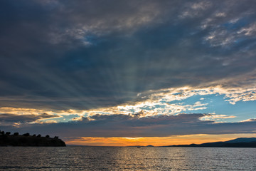 Sunbeam through clouds before sunset, west coast of Sithonia
