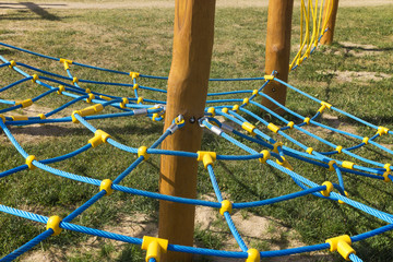 Rope climbing frame in the shape of cobwebs on the playground