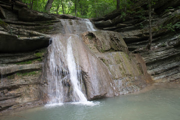 Naklejka premium Waterfall in rocks