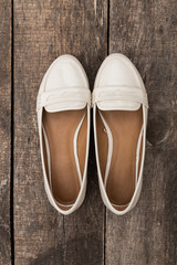 Woman clothes on old wooden background