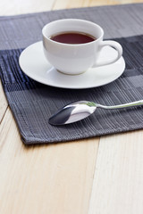 Tea in a white circle on a light table