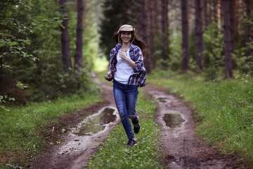 Young girl in the forest ranger