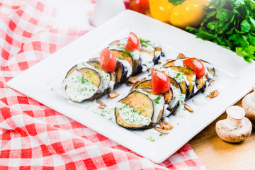 Grilled eggplant with tomatoes and sauce