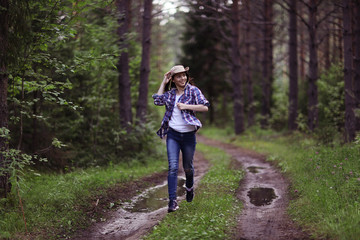 Obraz premium running girl forester in nature