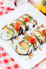 Grilled eggplant with tomatoes and sauce
