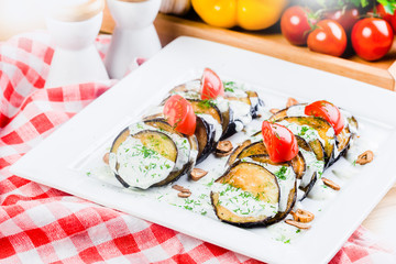 Grilled eggplant with tomatoes and sauce