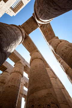 Columns of Karnak Temple, Luxor, Egypt. Wide, low angle view of the columns and hieroglyphics that dominate the centre of Karnak Temple. 