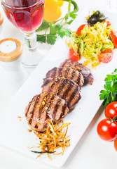 Grilled steaks with fresh vegetables