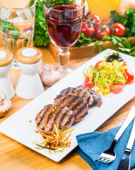 Grilled steaks with fresh vegetables