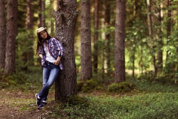 beautiful girl traveling in the woods