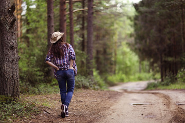 Young girl in the forest ranger