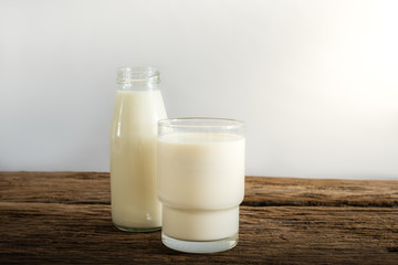 fresh milk in glass bottle and glass