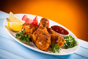 Roast chicken drumsticks and vegetables 