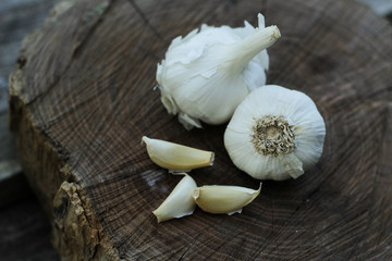 Garlic on wooden plank