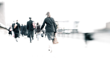 Rush hour commuters. Abstract long exposure, high key anonymous London City workers walking to work.