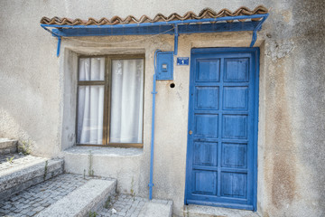 Fototapeta na wymiar Old House Entrance and blue Gate