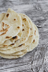 homemade tortilla on a light wooden background