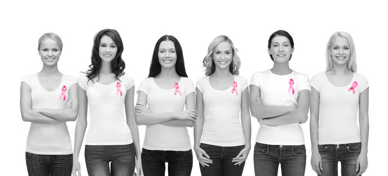 smiling women with pink cancer awareness ribbons