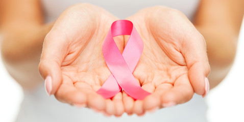 hands holding pink breast cancer awareness ribbon