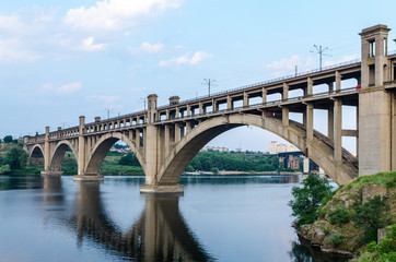 Fototapeta na wymiar road and rail split-level bridge over the river