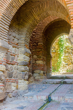 Ancient brick passageway door in the famous La Alcazaba in Malag