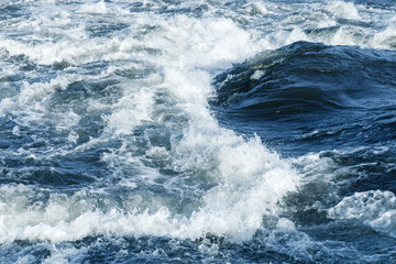 Fast river water background with waves