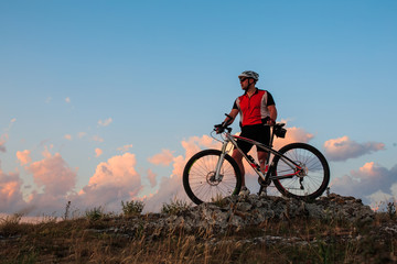 Fototapeta na wymiar Biker riding on bicycle in mountains