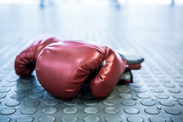Close up view of boxing gloves on industrial floor