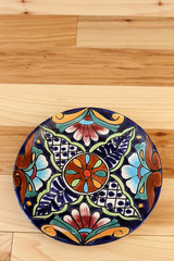Southwestern decorative talevera plate on wood 