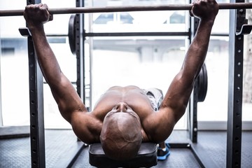 Naklejka premium Young Bodybuilder doing weightlifting 