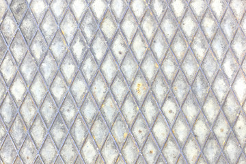 Rusty metallic surface with rhombus pattern