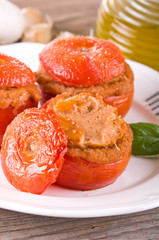 Stuffed tomatoes on a white plate. 