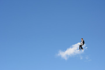 Fototapeta na wymiar Asian business woman sit on the cloud
