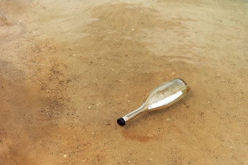 bottle in sand
