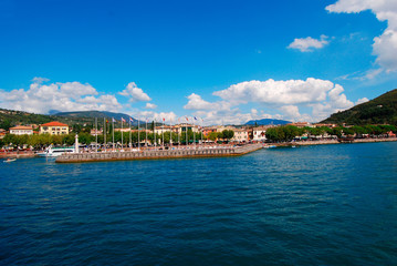 Fototapeta na wymiar GARDA, LAKE GARDA, ITALY - Garda, promenade with marina