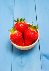strawberries on a blue board