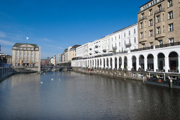 Fototapeta na wymiar HAMBURG, GERMANY - Swans on the Alster and Alster arcades from right.