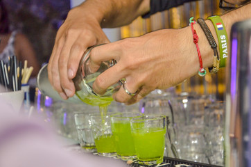 barman decoration a cocktail shoots green
