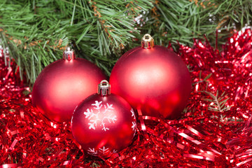 few red Christmas balls, tinsel and Xmas tree