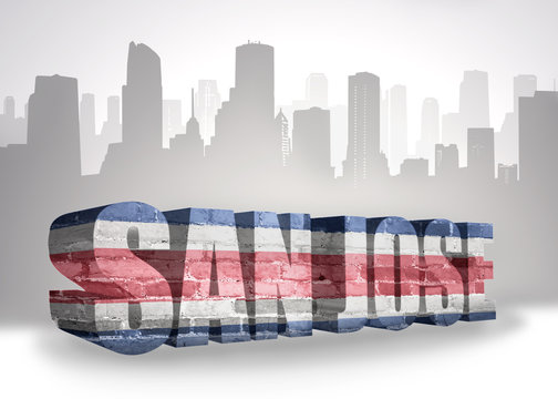 text san jose with national flag of costa rica near abstract silhouette of the city