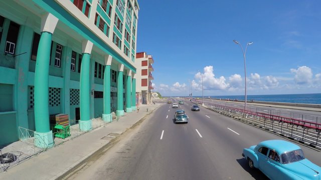 Driving in the famous Malecon Avenue, Havana, Cuba