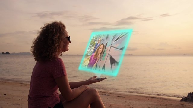 Girl Use Futuristic Hologram Interface. Watching Video. Hi-Tech