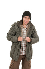 Fototapeta na wymiar latin young man wearing green winter coat and a beanie