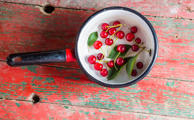 Fresh cherries in pot